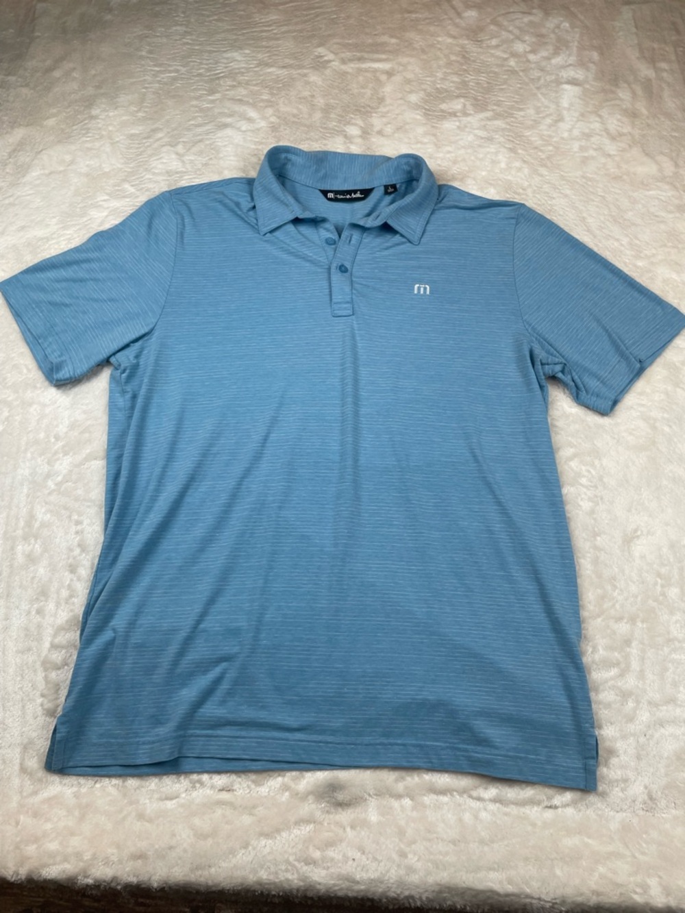 Travis Mathew Men’s Polo in Sky Blue with Subtle Stripe Texture
